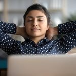 A girl relaxing from screen with closed eyes