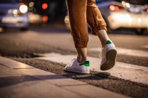 A woman walking in the night outside