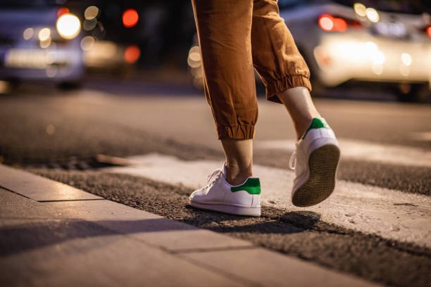 A woman walking in the night outside